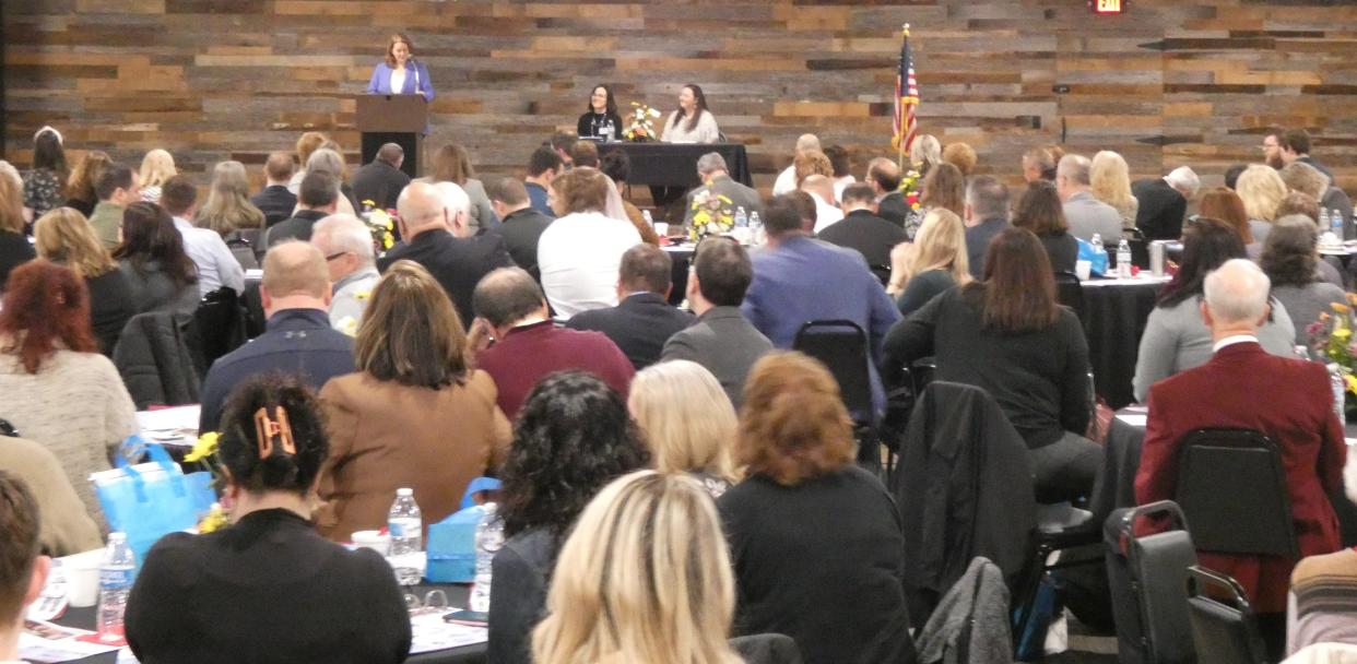 A crowd of roughly 200 people listens as Amber Wertman, executive director of the United Way of North Central Ohio, speaks during the annual forecast breakfast on Wednesday morning at The Venue at Old 30.