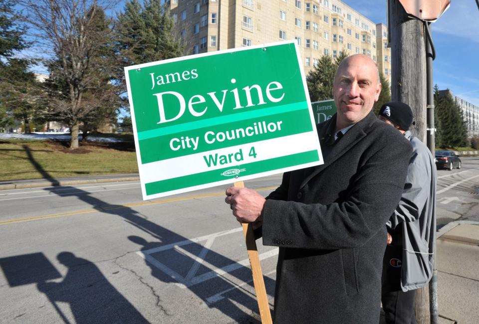 James Devine campaigns outside the Quincy Lodge of Elks polls during the Ward 4 city councilor preliminary election in Quincy, Tuesday, Jan. 17, 2023.