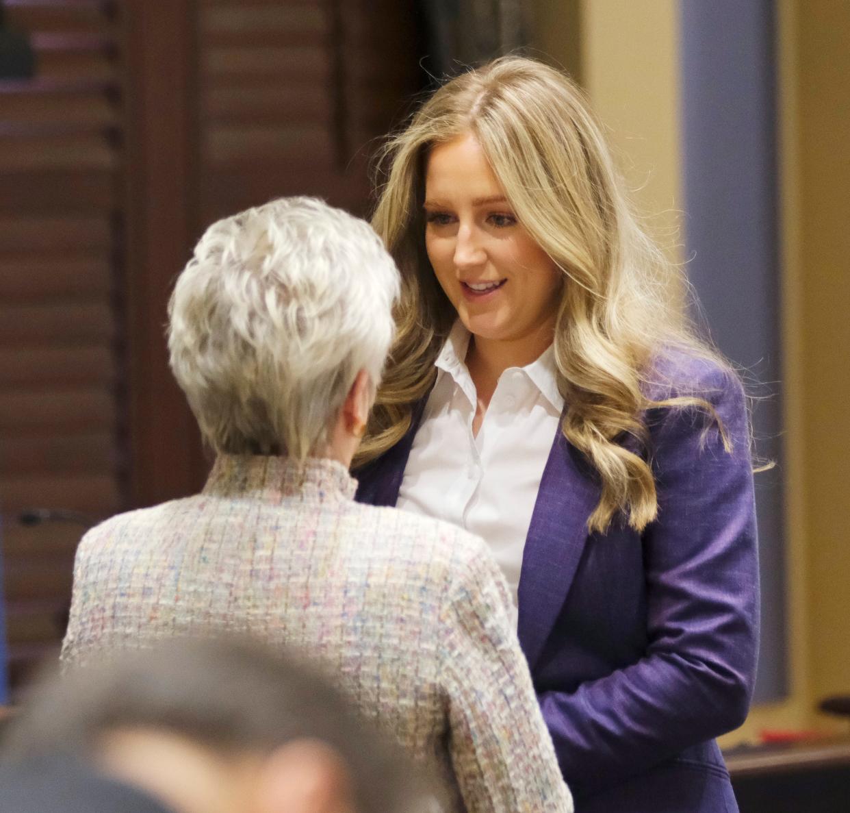 Sen. Ally Seifried visits with Sen. Julie Daniels at a Senate Education Committee meeting at the Oklahoma Capitol Tuesday, Feb. 27, 2024.