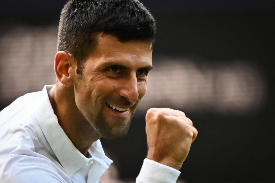 Serbia's Novak Djokovic celebrates after winning against Australia's Jordan Thompson in the Wimbledon Championships on July 5, 2023.