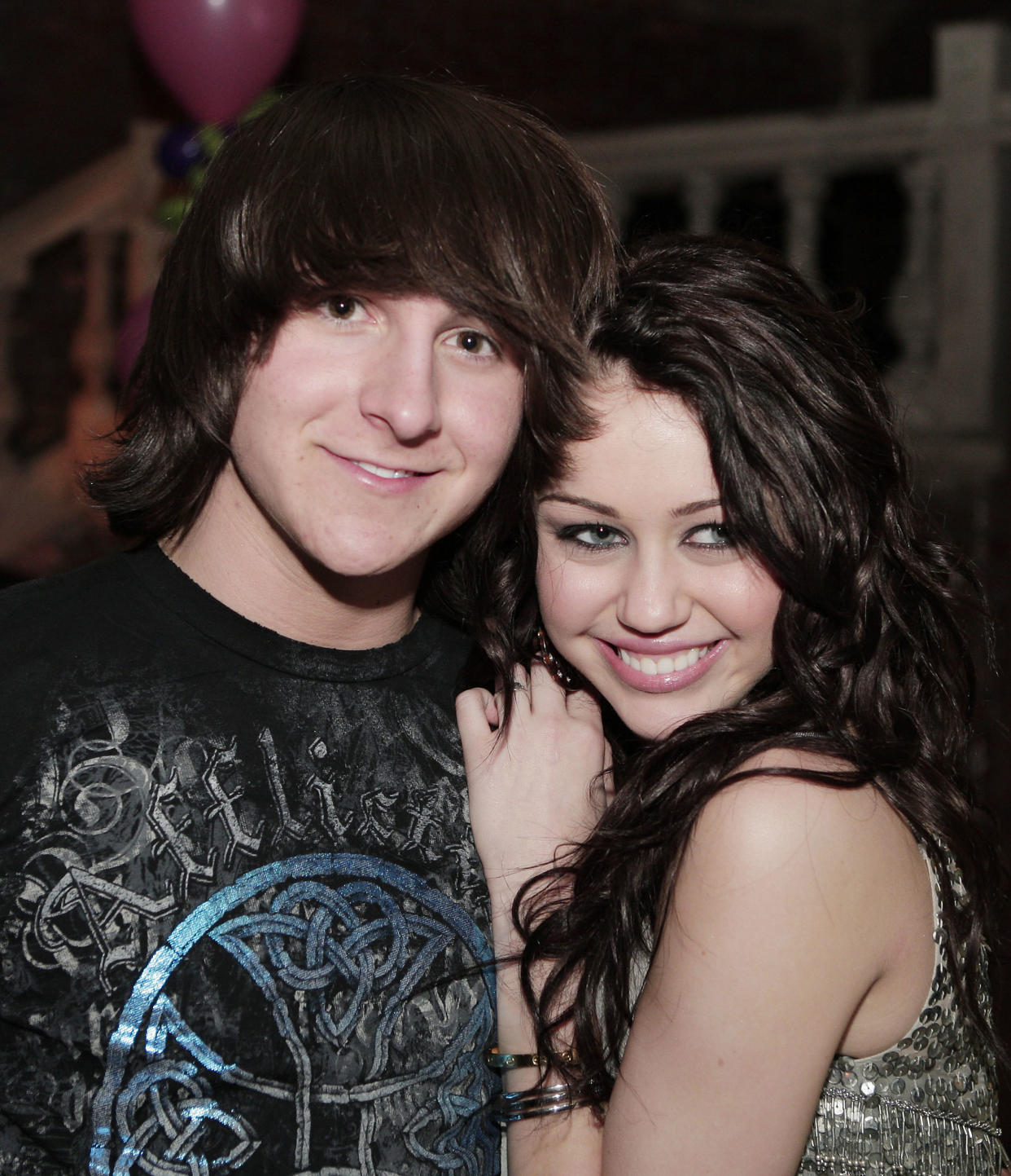 LOS ANGELES - JANUARY 17:  Actor Mitchel Musso (L) and actress/singer Miley Cyrus pose at the afterparty for the premiere of Walt Disney Pictures' 