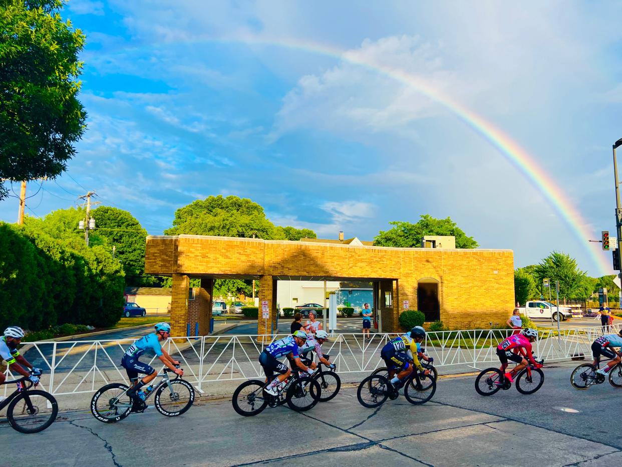 A photo submitted to the 2023 Tosa Life Photo Contest, titled "Racing to the Pot of Gold," shows Cafe Hollander's Tosa Village bike race. You can vote for this photo and more at tosaphotos.com.