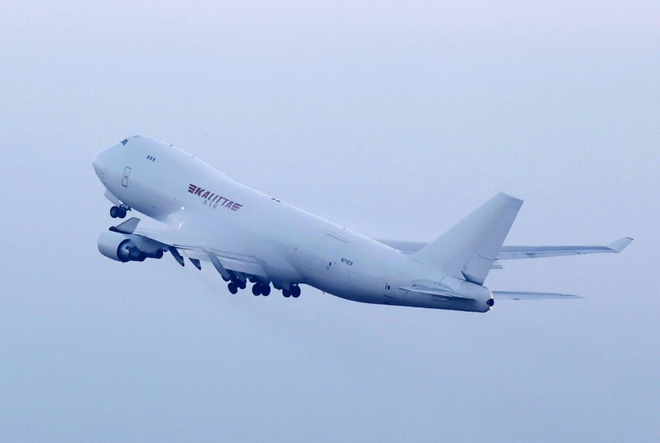 An airplane chartered by the U.S. government takes off at Haneda airport in Tokyo with U.S. passengers who were aboard the quarantined cruise ship the Diamond Princess docked at Yokohama, Monday, Feb. 17, 2020. The cruise ship was carrying nearly 3,500 passengers and crew members under quarantine. (Sadayuki Goto/Kyodo News via AP)