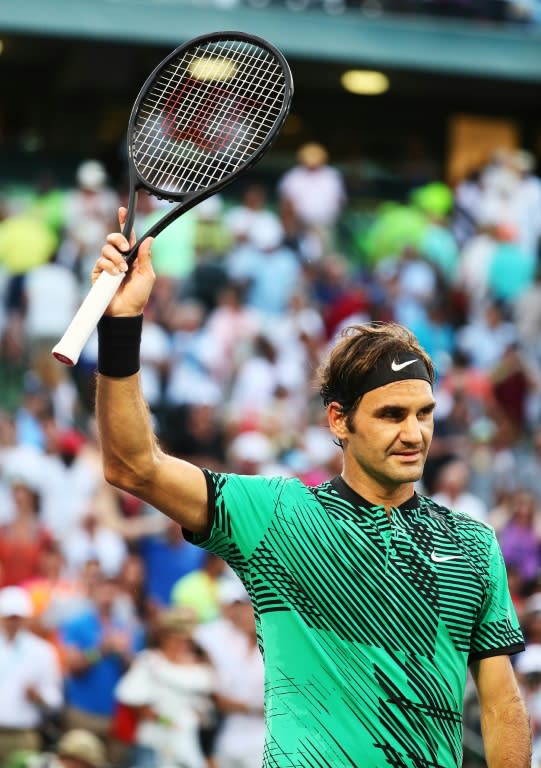 Roger Federer celebrates match point against Roberto Bautista Agut during their Miami Open 4th round match in Key Biscayne, Florida