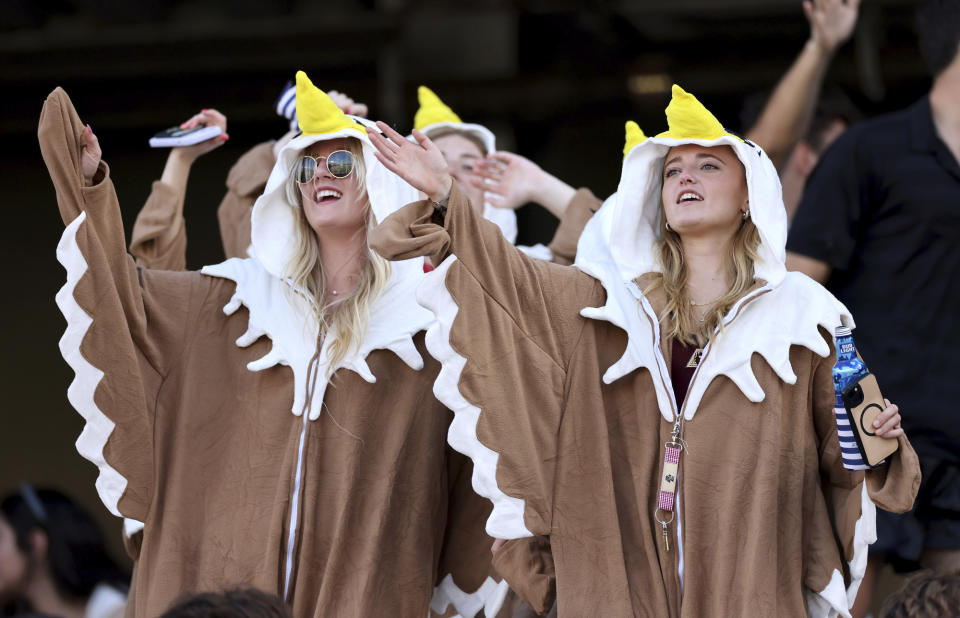 Boston College fans, dressed as eagles, the college's mascot, cheer on their team during the second half of an NCAA college football game against UConn Saturday, Oct. 28, 2023 in Boston. (AP Photo/Mark Stockwell)