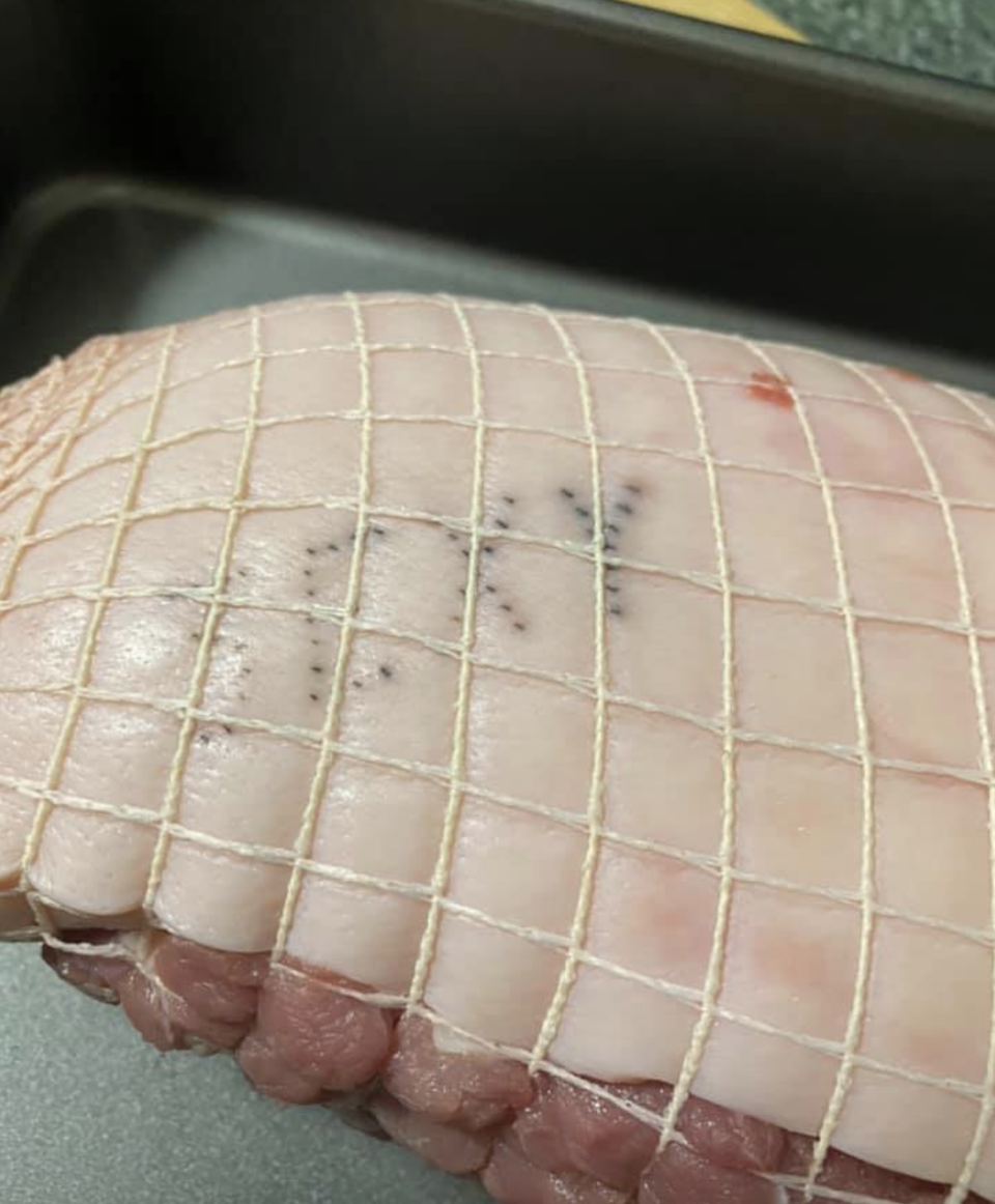 This stamped message on a Coles pork roast gave an Australian family a giggle who thought it looked like the word 'sexy'.