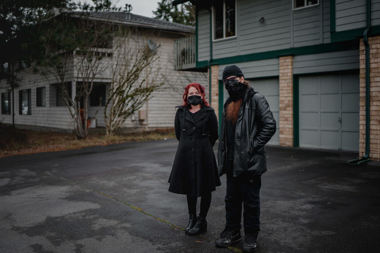 Landlord Rian de Laat, left, and tenant Ollie Aldama, in front of the condo that Aldama rents from de Laat in Seattle.