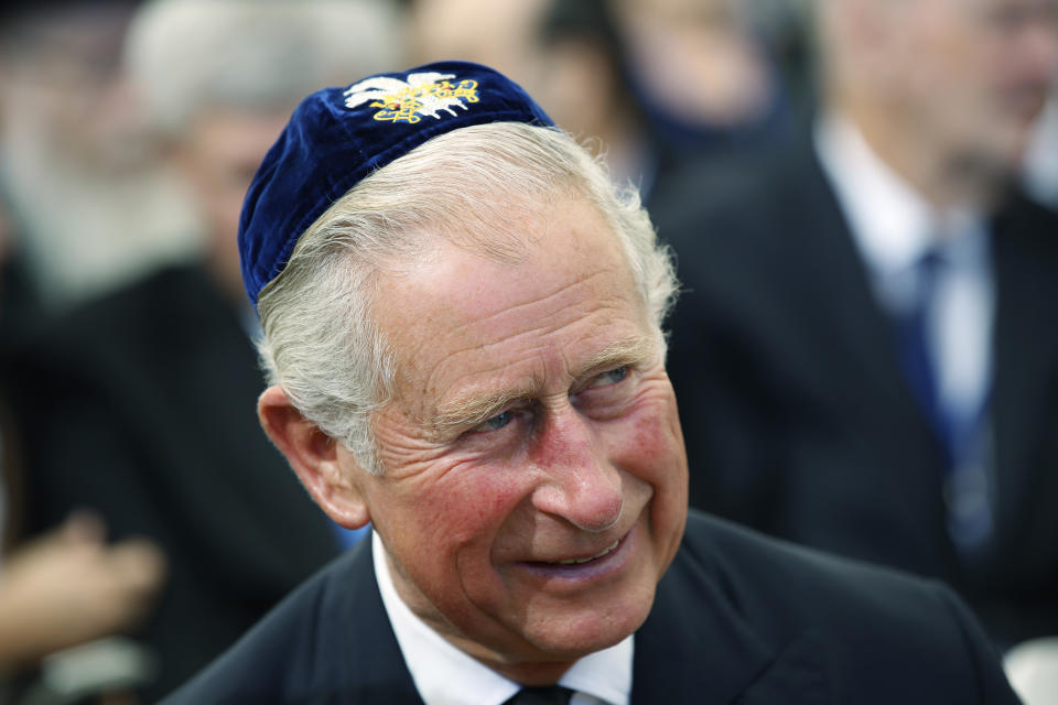 FILE - Britain's Prince Charles wears a 'Yarmulke,' or Jewish skull cap, during the funeral of Shimon Peres at Mt. Herzl Military Cemetery in Jerusalem, Friday, Sept. 23, 2016. At a time when religion is fueling tensions around the world — from Hindu nationalists in India to Jewish settlers in the West Bank and fundamentalist Christians in the United States, King Charles III is trying to bridge the differences between the faith groups that make up Britain’s increasingly diverse society. (Abir Sultan, Pool via AP, File)