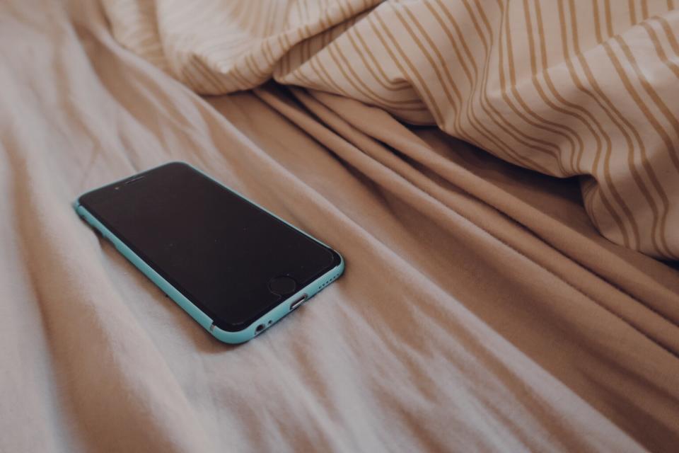 The stimulation of using a phone before bed may be what keeps people up, not the light the device emits. (Stock, Getty Images)