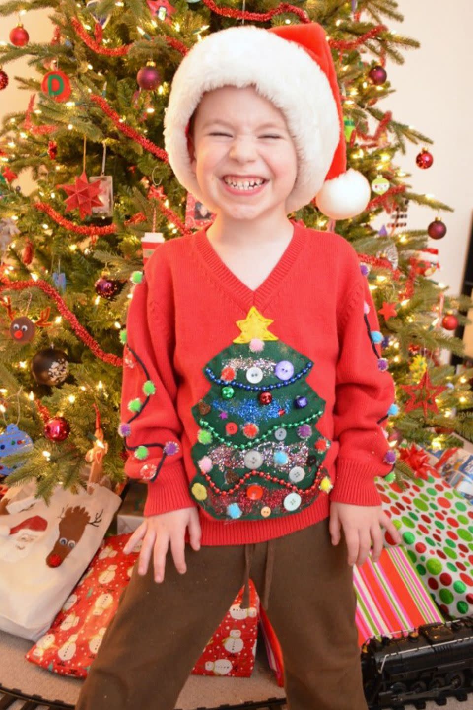 <p>Is it just us, or is it impossible to actually make a kid's Christmas sweater anything but adorable?</p><p><strong>Get the tutorial at <a href="http://www.oneartsymama.com/2013/12/diy-ugly-sweater.html" rel="nofollow noopener" target="_blank" data-ylk="slk:One Artsy Mama" class="link ">One Artsy Mama</a>.</strong></p>