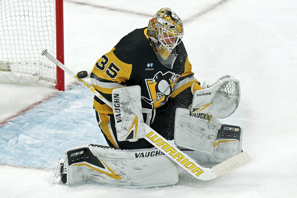 Pittsburgh Penguins goaltender Tristan Jarry (35) deflects a shot with his stick during the first period of an NHL hockey game agains the Winnipeg Jets, Tuesday, Feb. 6, 2024, in Pittsburgh. (AP Photo/Matt Freed)