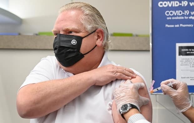 Ontario Premier Doug Ford receives the AstraZeneca vaccine against COVID-19 at a pharmacy in Toronto on April 9. 