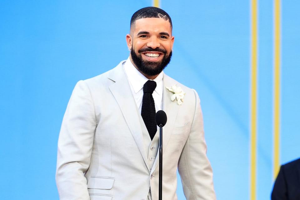 LOS ANGELES, CA - MAY 23: 2021 BILLBOARD MUSIC AWARDS -- Pictured: (l-r) Drake accepts Artist of the Decade with son Adonis on stage during the 2021 Billboard Music Awards held at the Microsoft Theater on May 23, 2021 in Los Angeles, California. -- (Photo by Christopher Polk/NBC/NBCU Photo Bank via Getty Images)