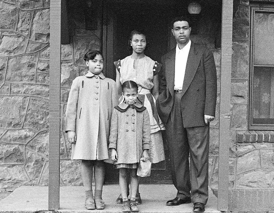 Linda Brown (left) with her parents, Leola and Oliver, and little sister Terry Lynn in front of their house in Topeka, Kansas, in 1954. (Photo: Carl Iwasaki via Getty Images)