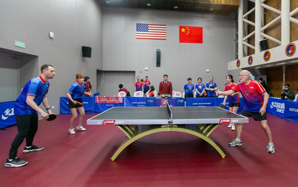 SHANGHAI, April 10, 2021 -- Players from both sides participate in a China-U.S. Ping-Pong friendly match during a special event in Shanghai, east China, April 10, 2021. A special event was held here on Saturday to commemorate the 50th anniversary of the Ping-Pong Diplomacy between China and the United States. (Photo by Wang Xiang/Xinhua via Getty) (Xinhua/Wang Xiang via Getty Images)