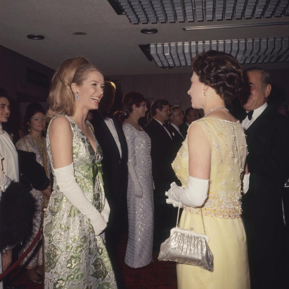 The Queen talks to Sally Ann Howes at the premiere of Chitty Chitty Bang Bang (PA) (PA Archive)