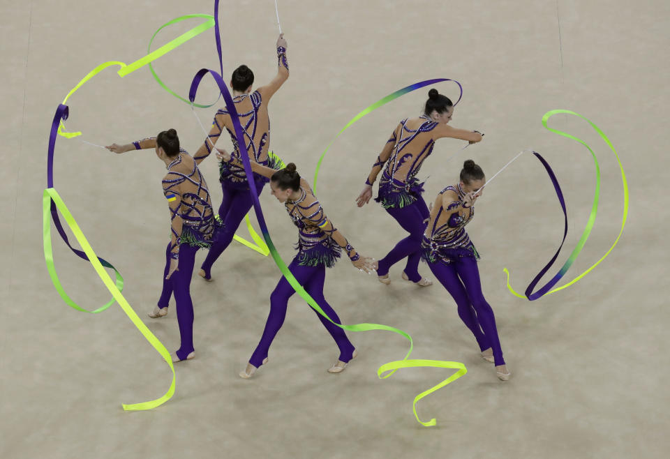 FILE - Team Ukraine performs during the rhythmic gymnastics group all-around final at the 2016 Summer Olympics at the Olympic stadium in Rio de Janeiro, Brazil, Sunday, Aug. 21, 2016. (AP Photo/Dmitri Lovetsky, File)