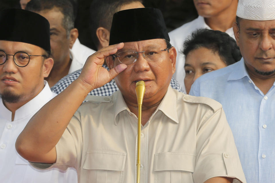 Indonesian presidential candidate Prabowo Subianto adjusts his glasses during a press conference in Jakarta, Indonesia, Wednesday, April 17, 2019. President Joko Widodo is on track to win a second term, preliminary election results showed Wednesday, in apparent victory for moderation over the ultra-nationalistic rhetoric of his rival Subianto. (AP Photo/Tatan Syuflana)