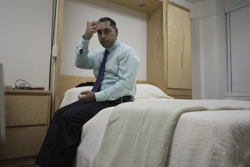 Dr. Roneil Malkani demonstrates the set up for a sleep study at the Center for Circadian & Sleep Medicine at Northwestern Medicine in Chicago on May 16, 2024. Pink noise has a frequency profile “very similar to the distribution of brain wave frequencies we see in slow-wave sleep because these are large, slow waves,” said Malkani, assistant professor of neurology at Northwestern University Feinberg School of Medicine. (AP Photo/Laura Bargfeld)