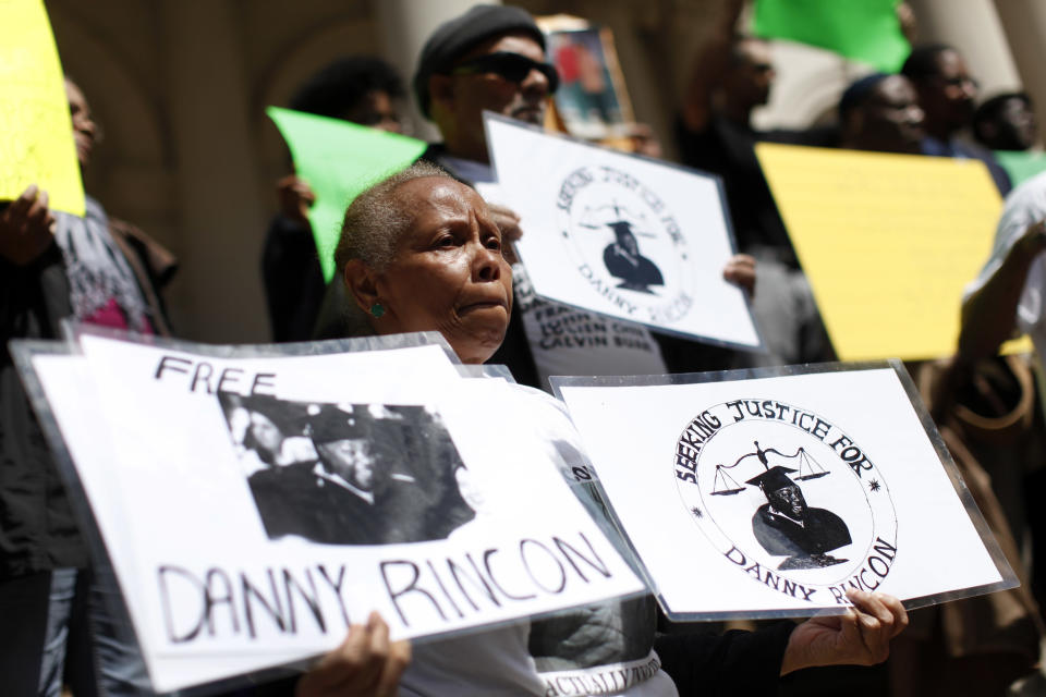 Family members of inmates who claim they were wrongfully convicted gather to show support as a group of New York City men, who claim they were framed by a crooked police detective decades ago, voice their demand for prosecutors to speed up an ongoing review of the detective's cases at a rally on the steps of City Hall, Wednesday, April 9, 2014, in New York. (AP Photo/Jason DeCrow)