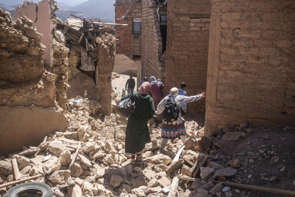 Residents flee their homes after an earthquake in Moulay Brahim village, near the epicenter of the earthquake, outside Marrakech, Morocco, Saturday, Sept. 9, 2023. (AP Photo/Mosa’ab Elshamy)