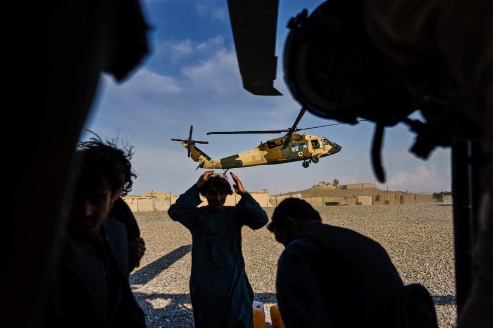 During a resupply mission, a UH-60 Black Hawk arrives at an outpost in the Shah Wali Kot district