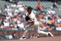 San Francisco Giants pitcher Jordan Hicks (12) throws against the Washington Nationals during the first inning of a baseball game in San Francisco, Wednesday, April 10, 2024. (AP Photo/Jed Jacobsohn)