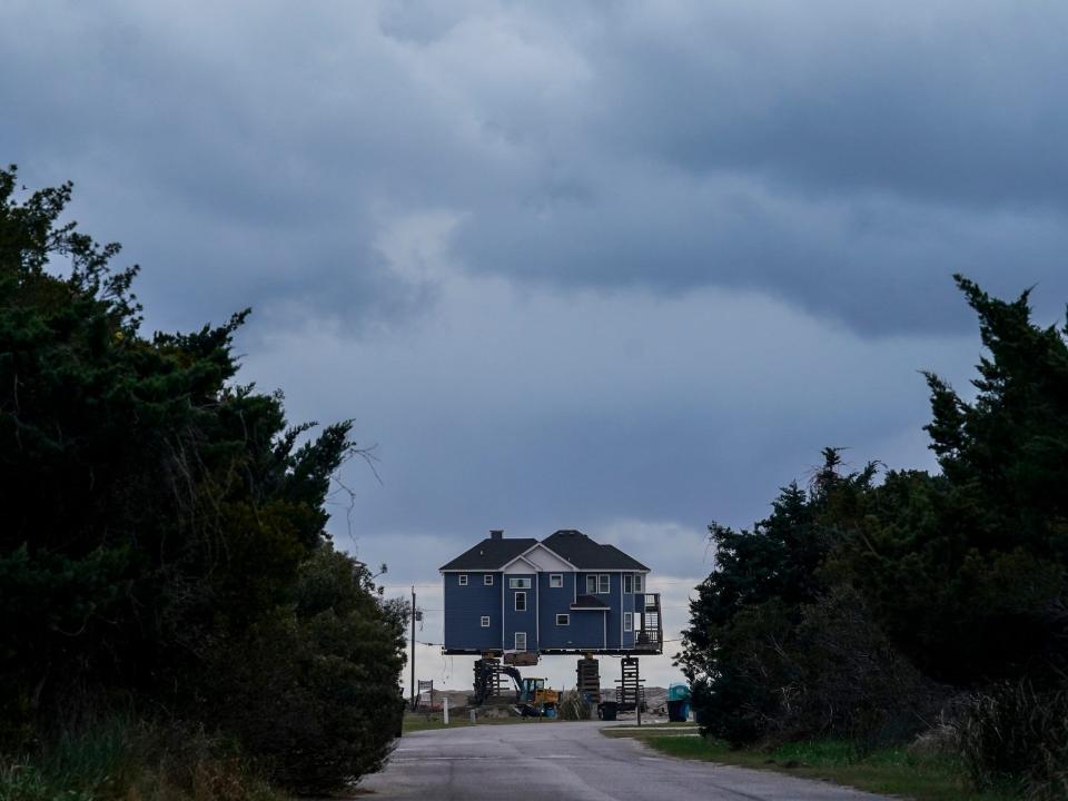 A beachfront house is raised and moved away from the rapidly eroding shoreline in Rodanthe in December 2022.