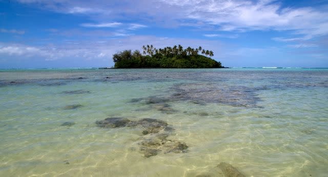 An island dots Muri beach on the Island of Rarotonga, the largest island in the Cook Islands