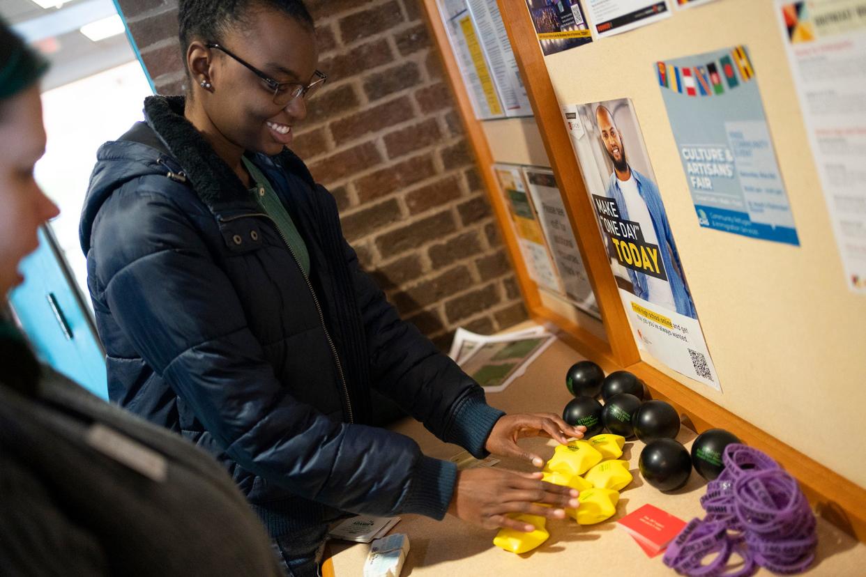 Pickerington High School Central junior Zion Walker, 17, of Pickerington, puts up flyers and swag Tuesday for the Black Teen Mental Health Coalition that she founded to help educate her fellow teens about youth mental health.
