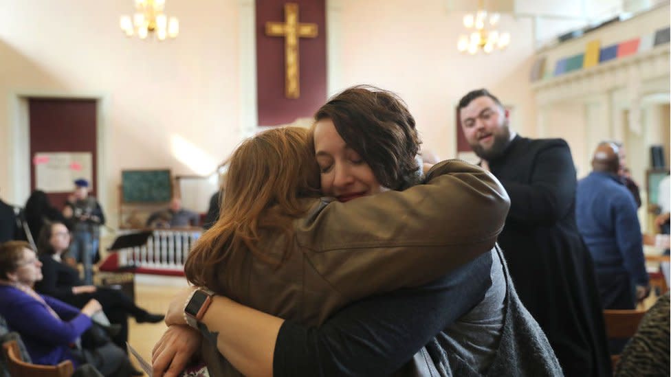 Two people hugging