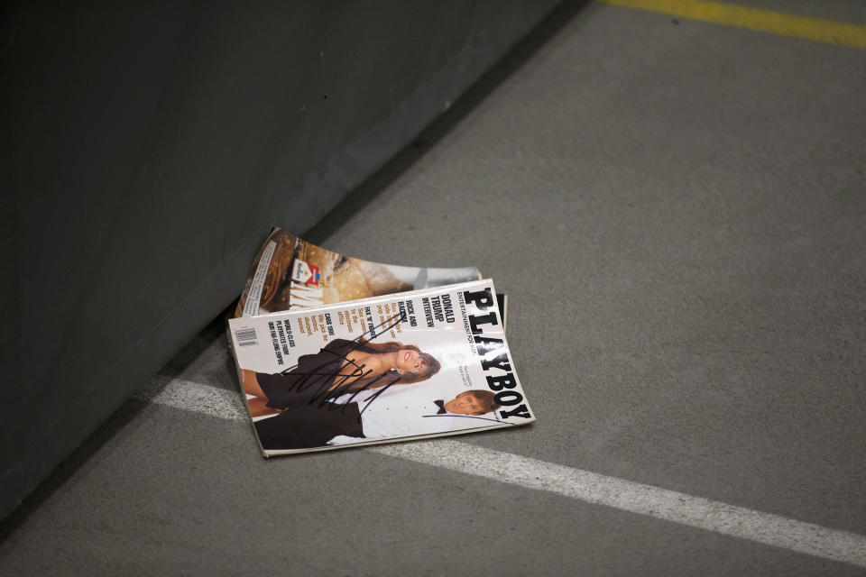 <p>A <em>Playboy</em> magazine with a picture of Donald Trump sits on the floor after it was signed by the Republican presidential candidate but failed to reach its owner when it was tossed back into the crowd during a rally at Macomb Community College on March 4, 2016, in Warren, Mich. (Photo: Scott Olson/Getty Images) </p>