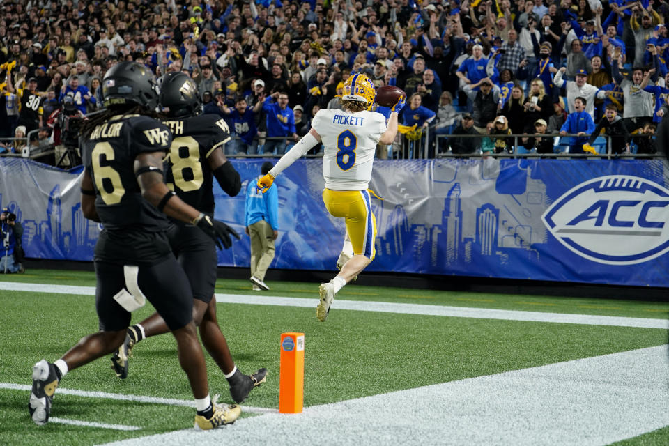 Pittsburgh quarterback Kenny Pickett celebrates after scoring against Wake Forest during the first half of the Atlantic Coast Conference championship NCAA college football game Saturday, Dec. 4, 2021, in Charlotte, N.C. (AP Photo/Jacob Kupferman)