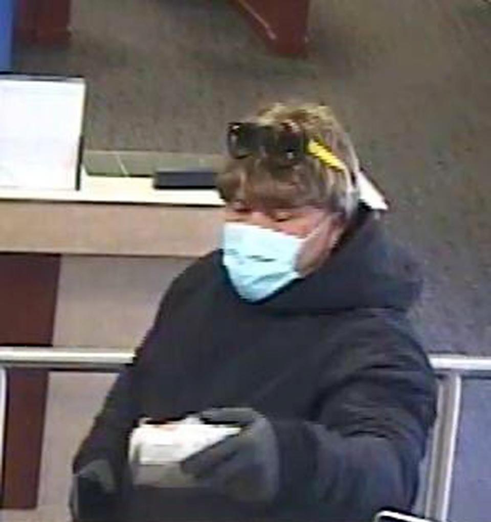 Falmouth Police released this surveillance photo on April 8 of the bank robber holding a hand gun at the Rockland Trust Bank on Davis Straits in Falmouth as it was robbed at about 9 a.m. that day. 
(Photo: Falmouth Police Handout photo via Facebook, Falmouth Police Handout photo via Facebook )