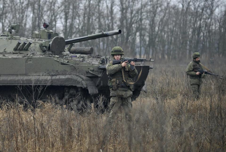 <span class="caption">Russian troops take part in drills in southern Russia in December 2021.</span> <span class="attribution"><span class="source">(AP Photo)</span></span>