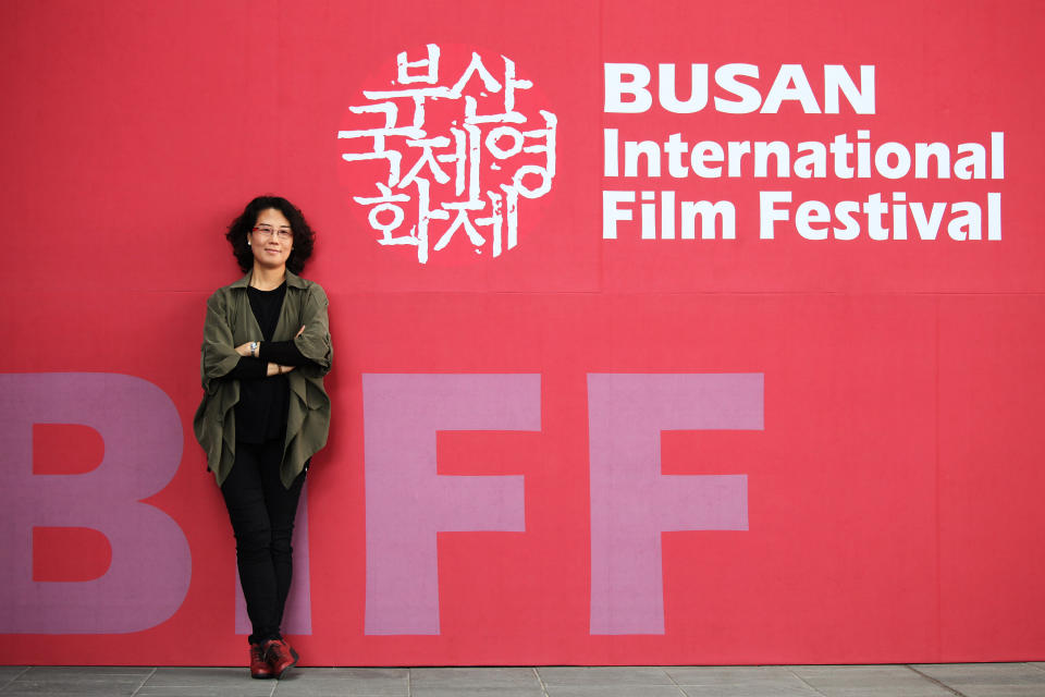In this Oct. 4, 2013 photo, South Korean Director Kim Lyang poses during an interview with the Associated Press at Busan Cinema Center in Busan, South Korea. Kim’s “Dream House by the Border” is one of 11 documentary features competing for a 10 million won ($9,300) prize at the Busan International Film Festival. (AP Photo/Woohae Cho)