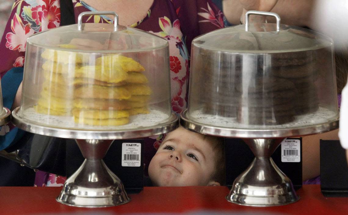 It’s love at first sight for three year old Hayden Butts, of Raleigh, under the baked goods tent at the State Farmer’s Market. Butts was staring at stacks of fresh baked cookies as he wandered through the tent with his parents