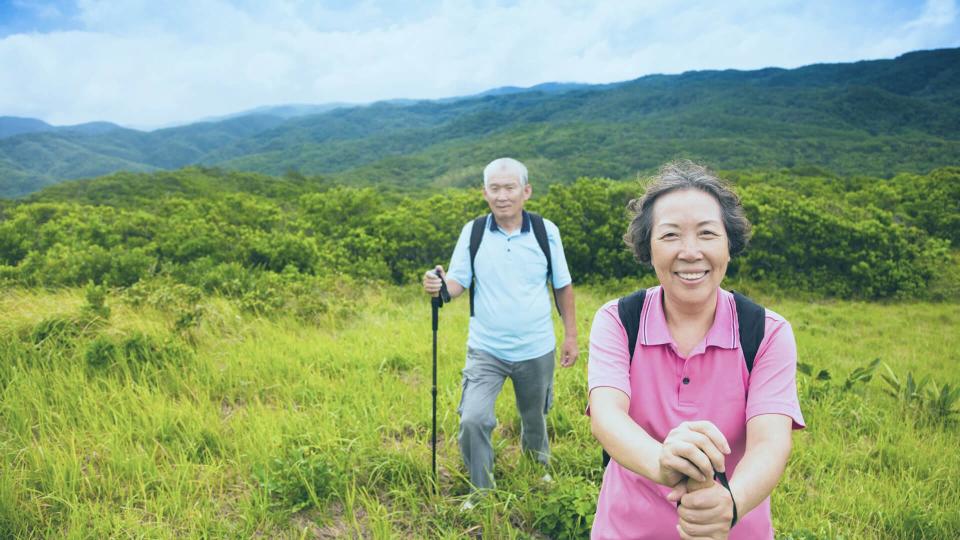 active elderly couple on a hike