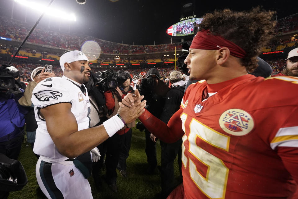 Philadelphia Eagles quarterback Jalen Hurts, left, and Kansas City Chiefs quarterback Patrick Mahomes (15) shake hands following an NFL football game on Monday, Nov. 20, 2023, in Kansas City, Mo. The Eagles won 21-17. (AP Photo/Charlie Riedel)