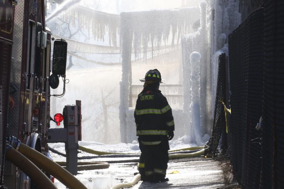 Firefighters extinguish a fire that destroyed a chemical plant off of Route 21 in Passaic, NJ on January 15. 2022. The structure is on Passaic St.