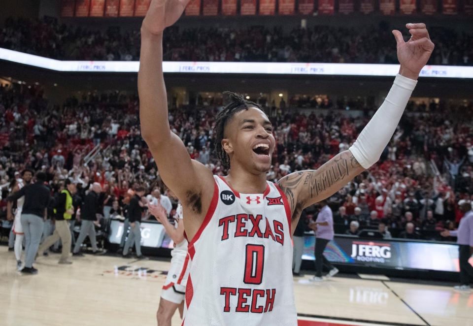 Texas Tech guard Chance McMillian (0) gestures to the crowd after the Red Raiders edged Kansas State, 60-59, Saturday at United Supermarkets Arena.