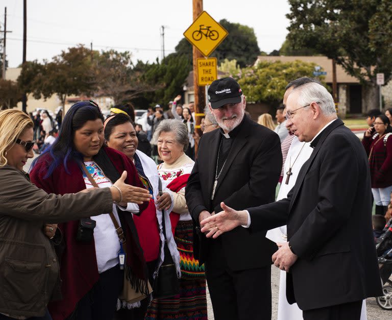 Bishop David O'Connell (center) and Archbishop José H. Gomez greet people during the annual Our Lady of Guadalupe procession in Los Angeles in 2019. (Victor Alemán/Angelus News)