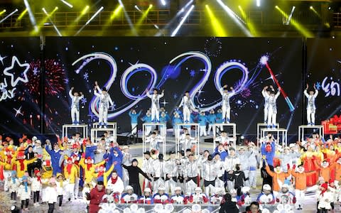 People celebrate the new year during an event at Shougang Industrial Park - Credit: &nbsp;JASON LEE/Reuters