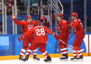 <p>Nikita Gusev #97 of Olympic Athlete from Russia celebrates with teammates after scoring a goal in the third period against Germany during the Men’s Gold Medal Game on day sixteen of the PyeongChang 2018 Winter Olympic Games at Gangneung Hockey Centre on February 25, 2018 in Gangneung, South Korea. (Photo by Bruce Bennett/Getty Images) </p>