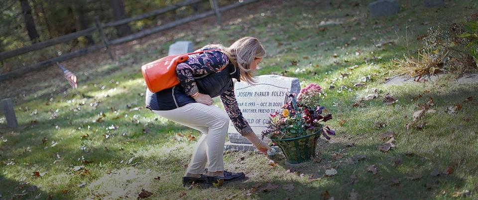 Melissa Foley at the grave of her son Parker on Friday, Nov. 12, 2021.