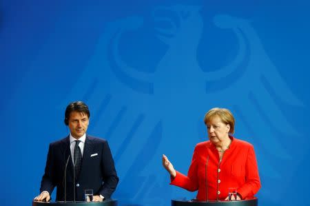 German Chancellor Angela Merkel and Italian Prime Minister Giuseppe Conte hold a news conference at the chancellery in Berlin, Germany, June 18, 2018. REUTERS/Hannibal Hanschke