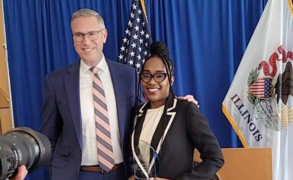 Illinois State Treasurer Michael Frerichs, left, poses for a photo with Think Big co-founder Sheila Hill, who's holding her Outstanding Service in Leadership Award, Monday, March 25, 2024, in Chicago.