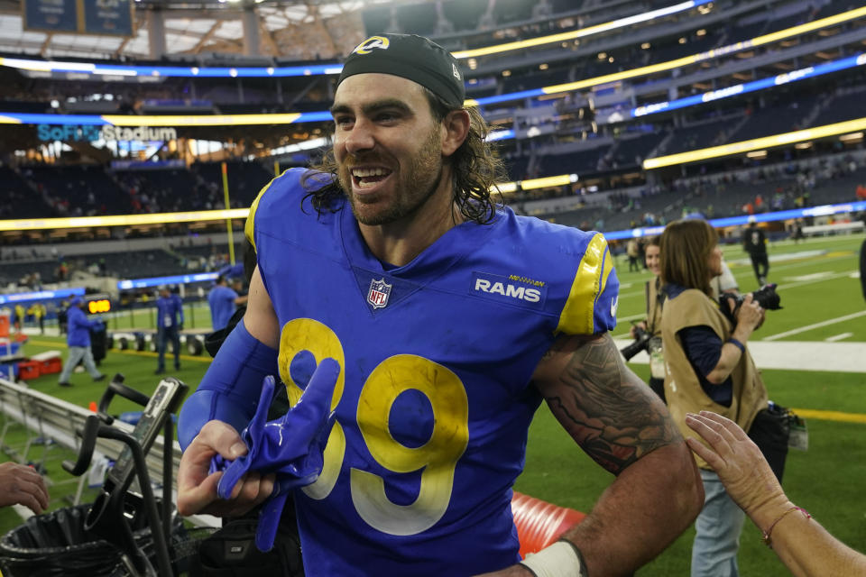 Los Angeles Rams tight end Tyler Higbee smiles has he leaves the field after their win in an NFL football game between the Los Angeles Rams and the Denver Broncos on Sunday, Dec. 25, 2022, in Inglewood, Calif. (AP Photo/Marcio J. Sanchez)