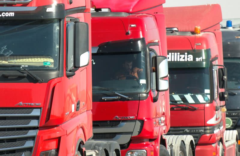 Driver sits in a truck during a truckers strike over fuel price rises, in the southern city of Maan