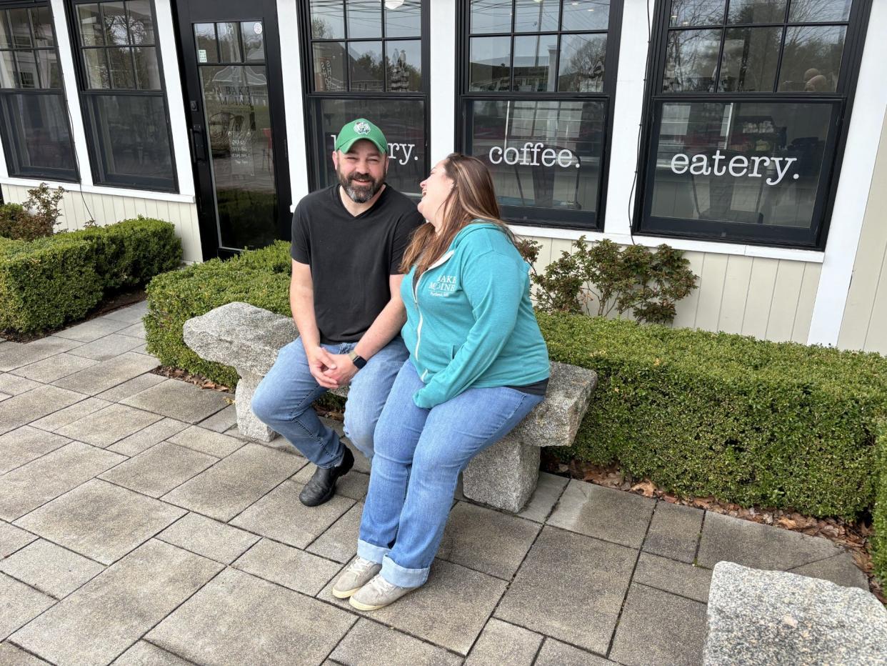 Doug and Kristen Perry enjoy a light moment in front of their new bakery, Bake Maine, on Post Road in their hometown of Wells, Maine, on Thursday, May 2, 2024.